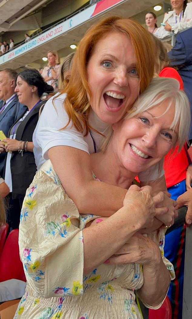 60946847-11070267-She_s_behind_you_Spice_Girl_Geri_hugs_Nadine_Dorries_at_the_fina-m-3_1659376...jpg